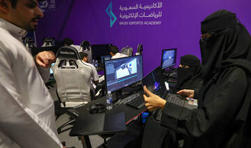 Saudi trainees attend a training course at the Saudi Esport Academy in Riyadh on August 29, 2023. (AFP)