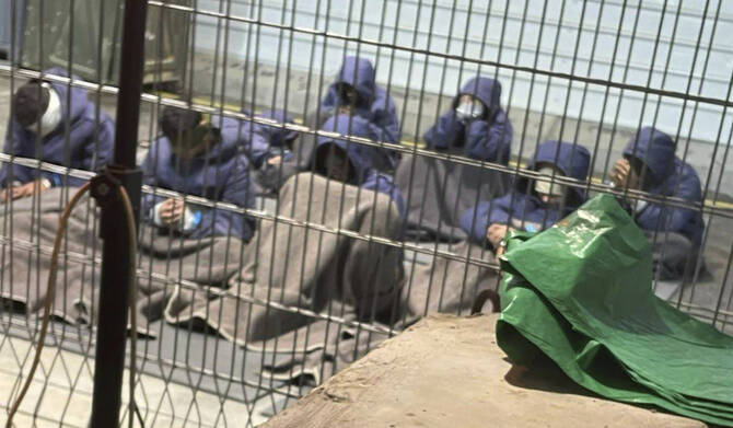 Palestinian prisoners captured in Gaza by Israeli forces at a detention facility on the Sde Teiman military base in Israel. (AP)
