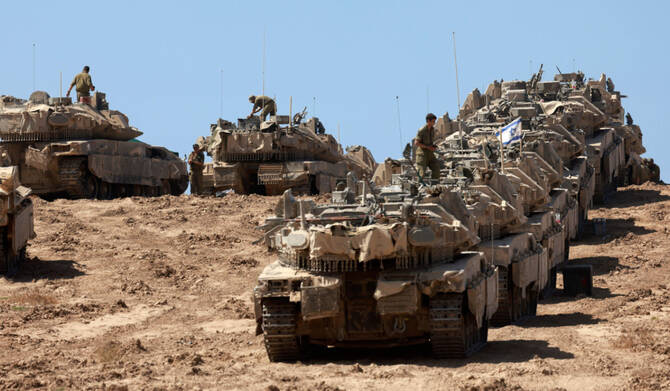 A convoy of Israeli tanks is deployed at Israel's border with the Gaza Strip on September 16, 2025. (AFP)